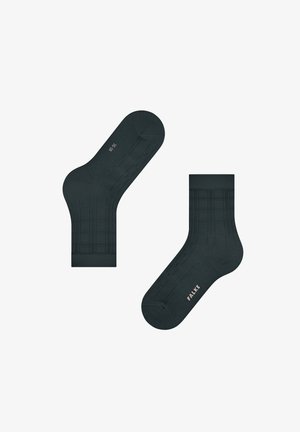 Dunkelgrüne Socken mit einem gerippten Muster, einer glatten Textur, verstärktem Fersen- und Zehenbereich sowie geprägtem "FALKE"-Logo.