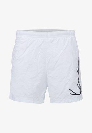 Shorts de bain blancs en matériau léger, avec un design abstrait noir sur le côté droit et une taille élastique.