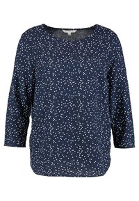Top a maniche lunghe blu navy con scollo rotondo, caratterizzato da un motivo di punti bianchi e rossi disseminati. Tessuto morbido.