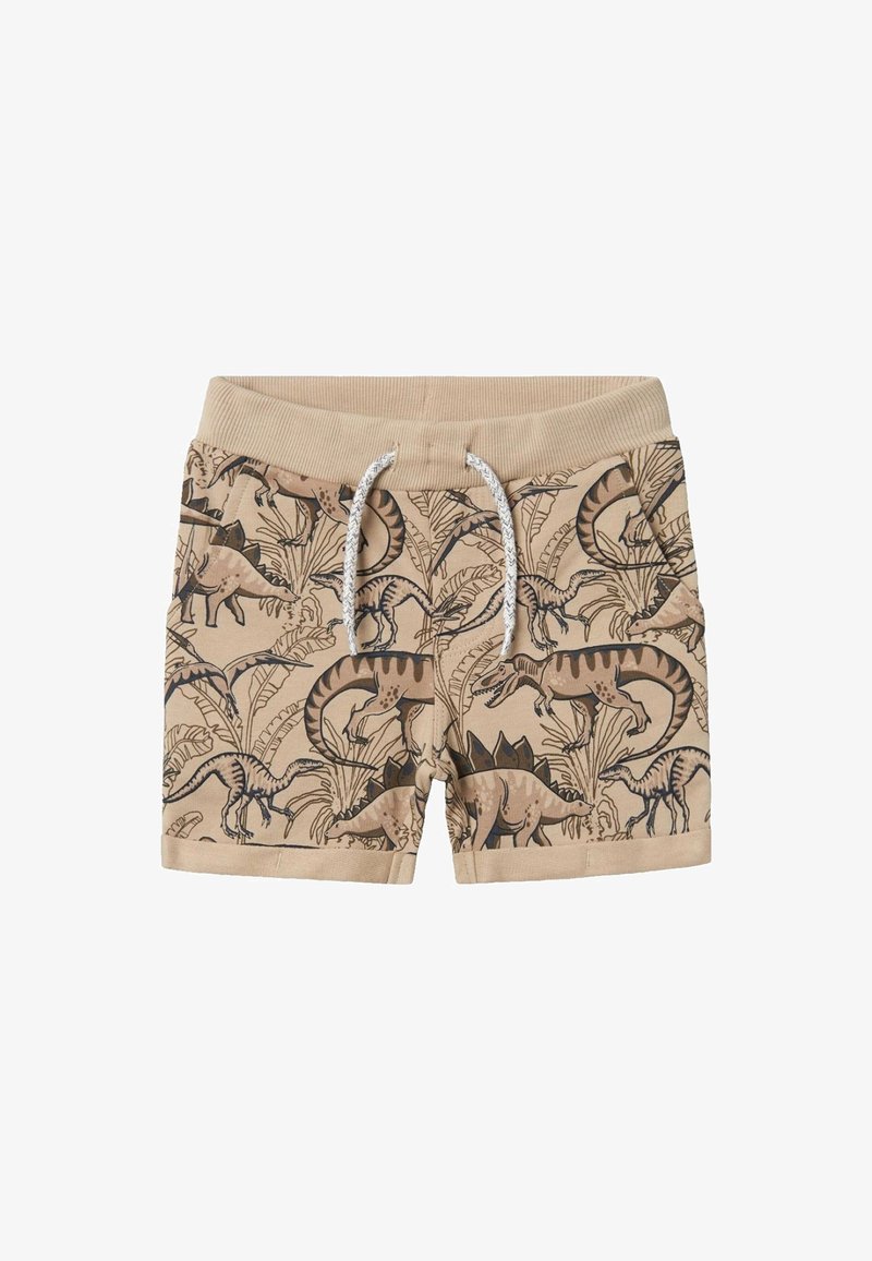 Beigefarbene Kindershorts mit weißer Kordel und durchgängigem braunen Dinosaurier- und Blattmuster, das verschiedene Dinosaurierarten zeigt.