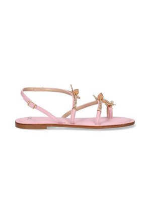 Sandalias planas rosas con múltiples correas delgadas, lazos decorativos y una suela texturizada. El diseño enfatiza la simplicidad y la elegancia.