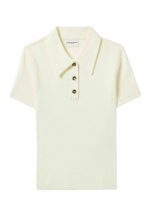 Polo shirt crema a maniche corte con texture a costine, colletto classico e patta con tre bottoni. Etichetta visibile all'interno del colletto.