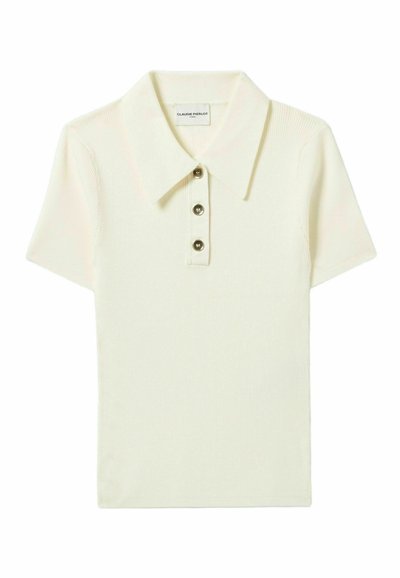 Camisa polo corta de manga en color crema con textura acanalada, tapeta de tres botones y cuello clásico. Etiqueta visible dentro del cuello.