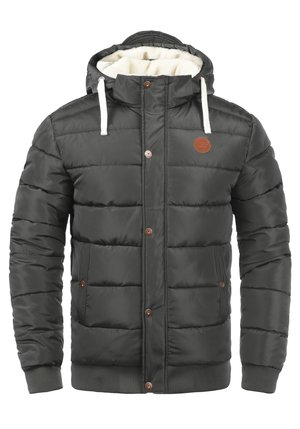 Dark grey puffer jacket with a hood, featuring a fuzzy white lining, snap buttons, and ribbed cuffs. Has a small brown logo patch on the chest.