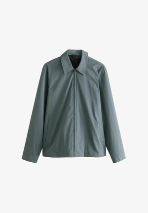 Šviesiai žalias zip-up džemperis su dideliu apykakle, ilgomis rankovėmis ir šoninėmis kišenėmis; pagamintas iš glotnaus, lengvo audinio.