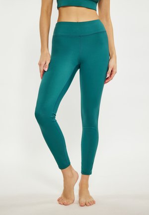 Teal vochtdoorgankelijke leggings met een hoge tailleband, een gladde textuur en een aansluitend ontwerp, met naadaccenten langs de benen.