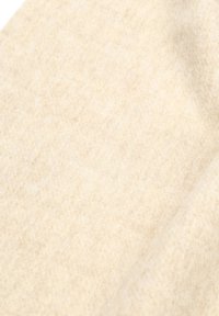 Beige wollen stof met een zachte, gestructureerde oppervlak. Licht fuzzy uiterlijk, met subtiele variaties in kleur en textuur.