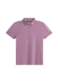 Kortärmad polo skjorta i ljus lila, tillverkad av ett slätt tyg. Har en krage, treknappsknäppning och logotypdetaljer på ärmen.