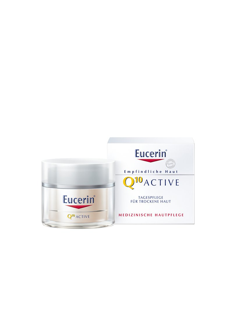 Eucerin Q10 Active cream in a clear glass jar with a silver lid, packaged in a white box with blue text, designed for dry skin.