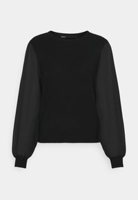 Svart topp med en solid kropp och genomskinliga långa ärmar. Rund halsringning med ribbade manchetter. Slät textur överlag med en elegant design.