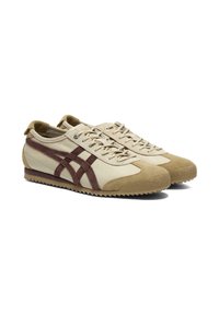 Sneaker beige con dettagli in suede marrone, dotate di un upper in tessuto testurizzato, punta rotonda, lacci piatti e suola in gomma con motivo di trazione.