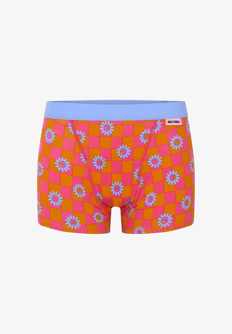 Boxer shorts colorés présentant un motif en damier orange et rose, avec une ceinture bleue et des fleurs blanches au centre rose.