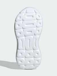 Semelle d'une sneaker blanche avec un fond texturé et motif comportant des indentations rectangulaires et ovales pour l'adhérence et la traction.