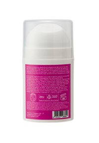 Bottiglia cilindrica bianca con tappo trasparente; etichetta rosa che dettaglia ingredienti e istruzioni per l'uso. Texture liscia, design compatto per una facile maneggevolezza.