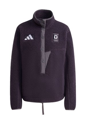 Fleecová bunda tmavě fialové barvy s vysokým límcem, zapínáním na knoflíky vpředu a dvěma logy. Má náprsní kapsu s kontrastním designem.