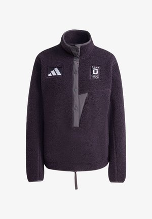 Fleecejakke i mørkelilla med høj krave, frontknaplukning og to logoer. Har en brystlomme med kontrasterende design.