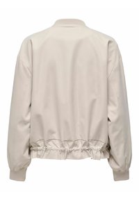 Blouson aviateur beige clair avec taille élastiquée et poignets côtelés, vu de dos sur un fond blanc.