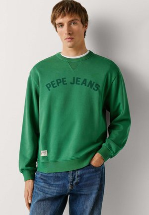 Sudadera verde de cuello redondo hecha de algodón, con cuello y puños acanalados. "PEPE JEANS" impreso en negrita en la parte delantera. Corte casual.