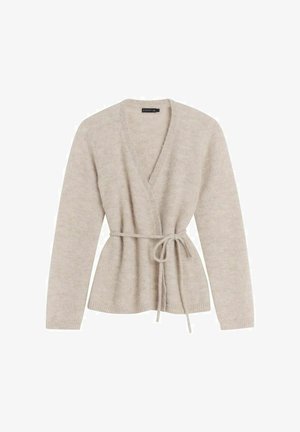 Beige wrap cardigan made of soft, textured material with a tie at the waist and long sleeves, featuring a deep V-neckline and ribbed cuffs.