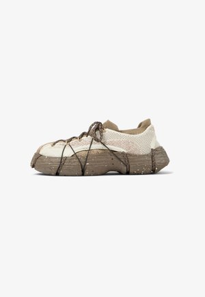 Lightweight sneakers with a mesh upper in beige and cream, featuring a textured brown sole and brown laces for secure fit.