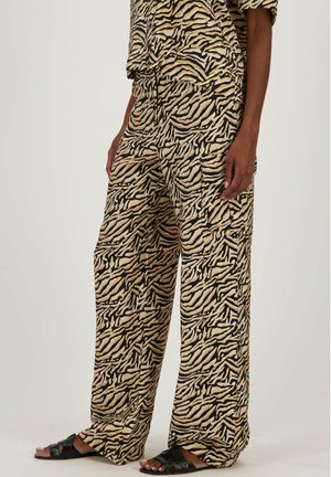 Wijde broek in beige, zwart en goud, met een tijgerprint. Gemaakt van lichtgewicht stof met een zachte textuur.