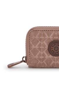 Wallet in soft, textured beige corduroy with embossed diamond pattern, round logo patch, and bronze-tone hardware zippered closure.