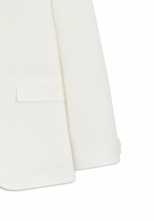 Weiße Texturiertes Blazermaterial am Ärmel und unteren Vorderteil mit Klappentasche und drei passenden Knöpfen am Ärmelabschluss.