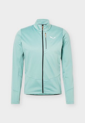 Ανοιχτό τιρκουάζ μακρυμάνικο μπουφάν με μαύρο φερμουάρ μπροστά, τσέπη στο στήθος με φερμουάρ, ψηλό γιακά και μικρό λευκό λογότυπο στο αριστερό μέρος του στήθους.