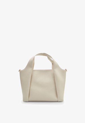 Beige textured leather handbag with two short handles and an open top. Features a minimalist design and subtle gold hardware accents.