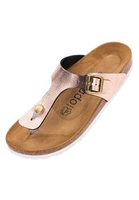 Metallisk roséguld tanga sandalett med en strukturerad rem, guldiga detaljer, korkfotbädd och vit gummisula. Flat och öppen tådesign.