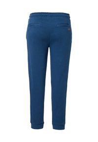 Blaue Sweatpants mit elastischem Bund, zwei Gesäßtaschen und gerippten Bündchen an den Knöcheln. Glatte Textur in einfarbiger Ausführung.