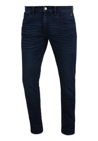 Temno modri jeans z ožjim krojem, ki imajo našite detajle, pet žepov in kovinsko zaponko. Teksturna površina.