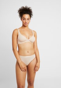 Hanro SENSATION SOFT CUP - Kaarituettomat rintaliivit - skin