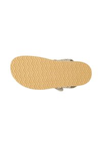 Sole of beige sandal with wavy tread pattern and braided straps partially visible above the sole.