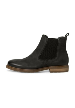 Svarta chelsea boots med slät läder och texturerade sidopaneler. Inkluderar en dragflik, brun gummisula och minimalistisk design.