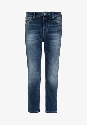 Dżinsy w ciemnym indygo z wyraźnym wyblakłym wykończeniem. Posiadają klasyczny design z pięcioma kieszeniami, przeszyte szwy i pas z zapięciem na guzik.