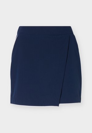 Mini-jupe bleu marine avec un design asymétrique portefeuille à l'avant et une texture subtile à côtes verticales.