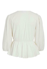 Top peplum bianco, tessuto texturizzato, scollatura rotonda, maniche lunghe a palloncino, cucitura in vita arricciata, morbido drappeggio all'orlo. Vista posteriore senza decorazioni.