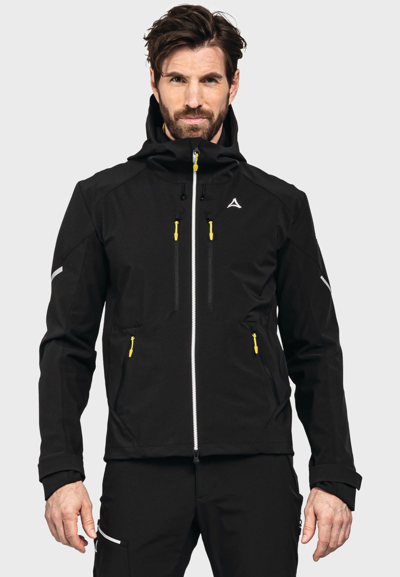 Schwarze Softshell-Jacke mit Kapuze, ausgestattet mit gelben Reißverschlüssen, mehreren Taschen und grauen Akzenten. Glatte Textur, ergonomisches Design.