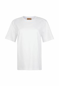 Hvid bomulds t-shirt med korte ærmer, har dekorationer med perforeringer på skulderen, rund halsudskæring og lige snit.