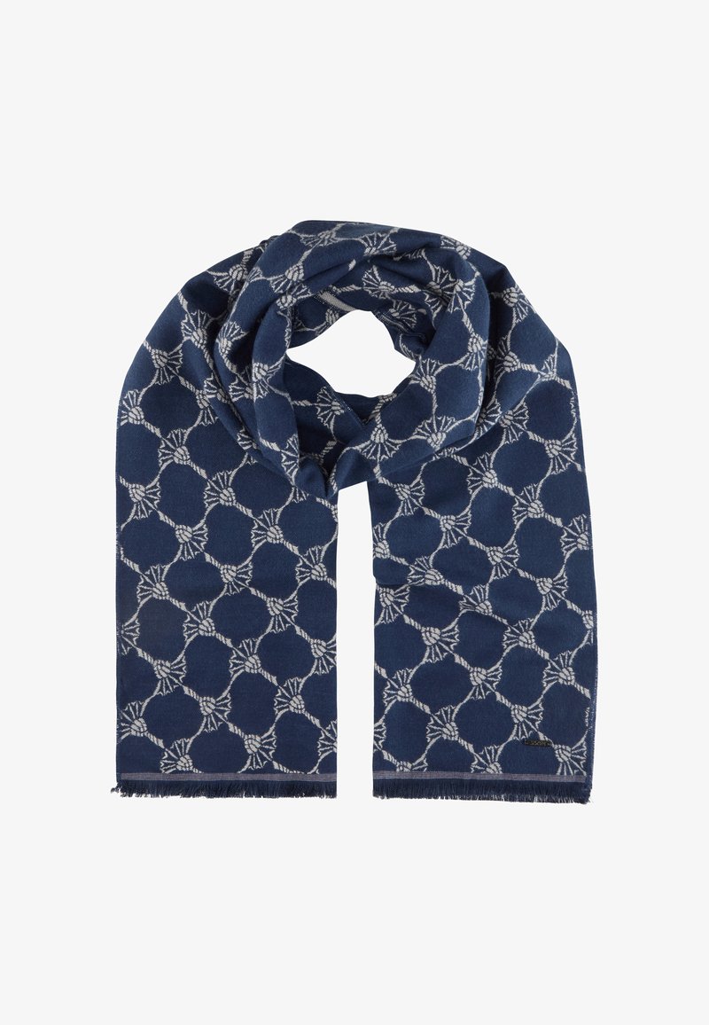 Écharpe bleu marine ornée d'un motif géométrique blanc de cercles entrelacés, terminée par des bords frangés pour une texture.