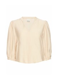 Ljusbeige blus med V-ringning, trekvartslånga puffärmar, drapering vid ärmslut och ett mjukt, strukturerat tyg. Varumärkesetikett synlig.