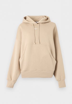 Beige Nike-hoodie met kangoeroezak, trekkoordkap, geribde boorden en zoom, afgebeeld tegen een witte achtergrond.