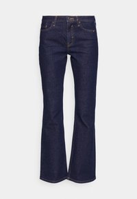 Jeans z ciemnego denimu w fasonie dzwonów, posiadające standardowe kieszenie i kontrastowe żółte przeszycia na szwach.