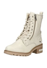 Béžová členková kožená členková obuv so šnurovaním, bočným zipsom, kožušinovou podšívkou, nízkym opätkom a logom koňa na päte a jazyku.