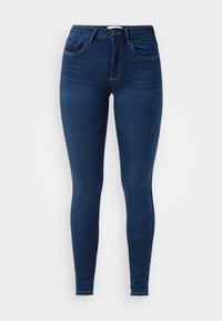 Slim fit, tumši zili džinsi, kas izgatavoti no denima. Iespējas ietver augstu jostu, jostas cilpas, priekšējos kabatas un smalkus šuvju detaļas.