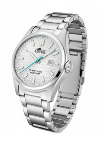 Orologio in acciaio con quadrante argentato dalla texture particolare, accenti turchesi, datario e bracciale in metallo massiccio. Impermeabile fino a 10 bar. Chiusura regolabile.