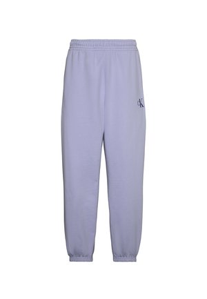 Pantalon de survêtement violet clair à taille élastique, poignets froncés et petit logo sombre "cK" sur la partie supérieure de la cuisse gauche.