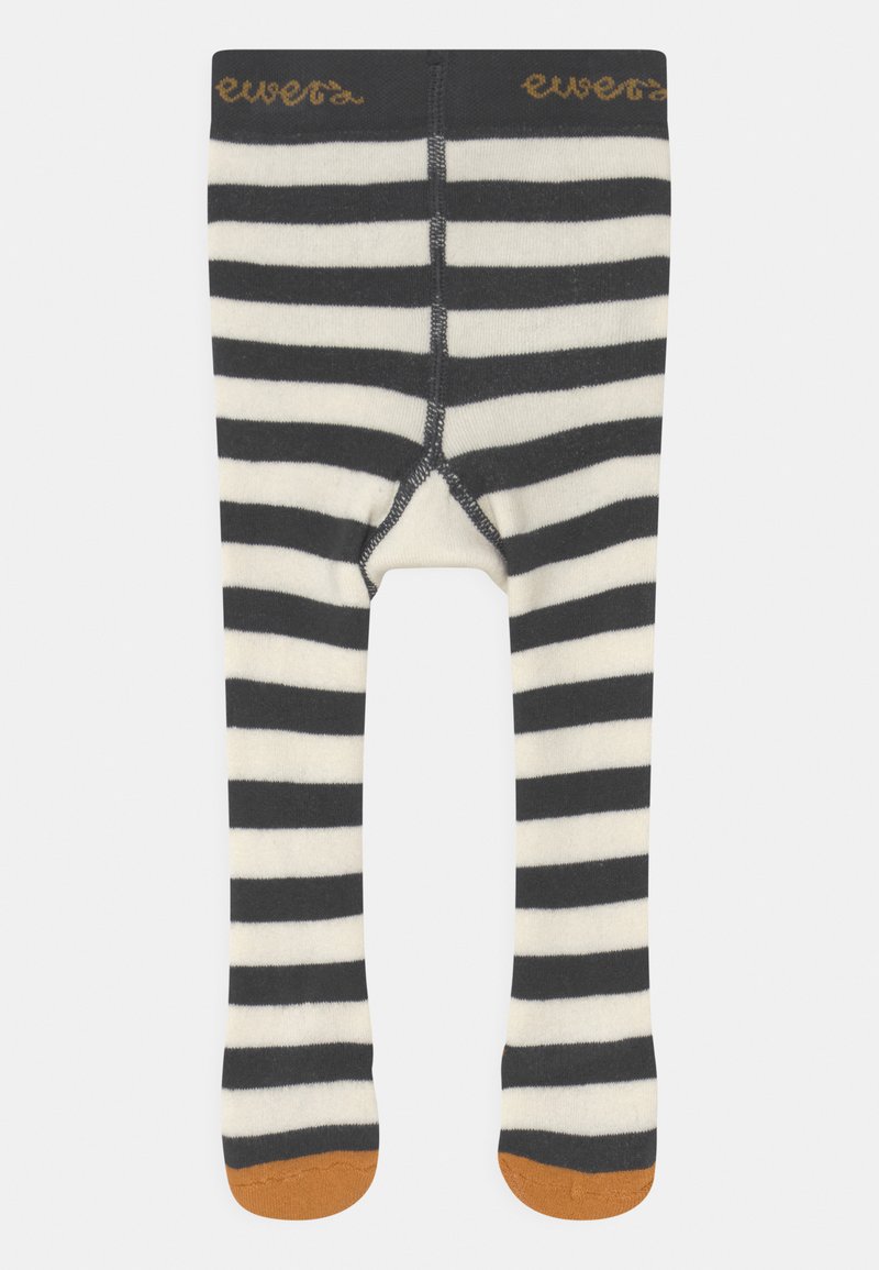 Black and cream striped tights with orange accents at the feet, featuring a smooth texture and a fitted design, with a logo on the waistband.
