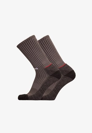 Gray knee-high socks with ribbed texture and reinforced heel and toe. Features a red accent at the cuff. Made from breathable material.